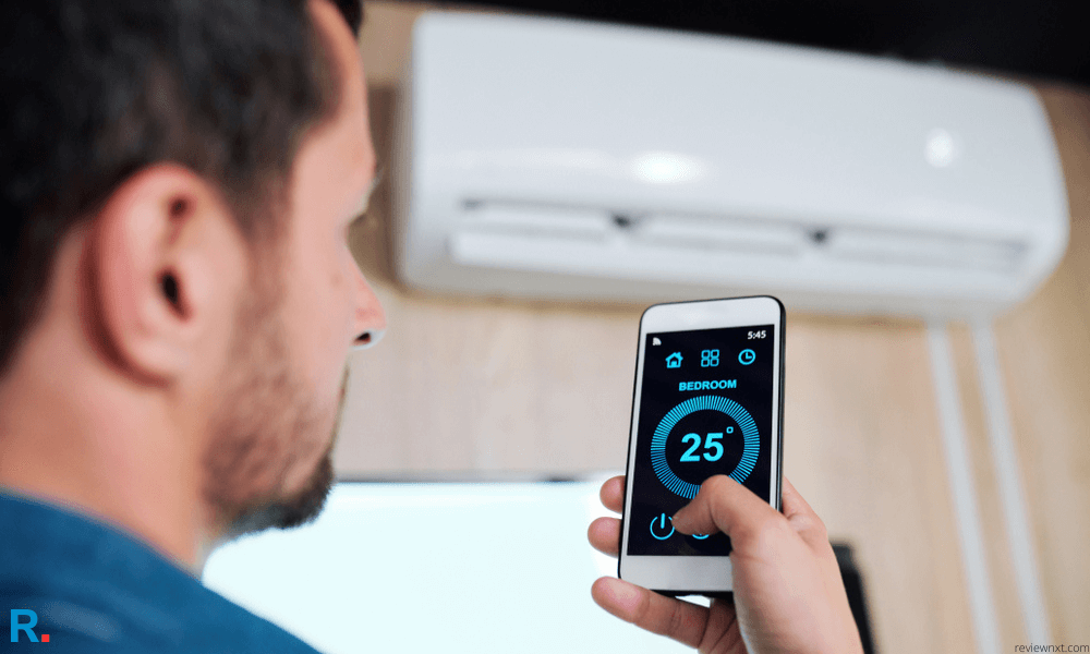 white man controlling a best smart ac in india using android app in mobile